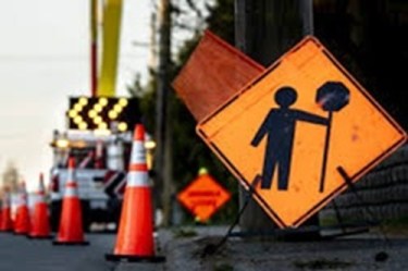 street construction sign and cones